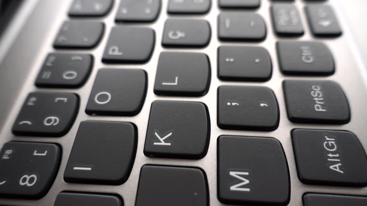 A Detailed Closeup Shot of a Sleek and Modern Computer Keyboard Showing the Keys Distinctly