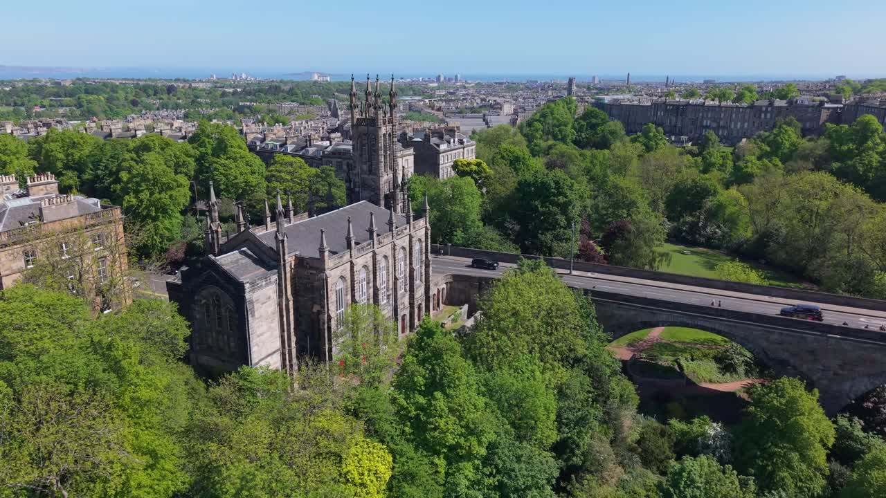 Drone reveal of a gothic church and Dean Bridge in Edinburgh, capturing classic architecture and the city’s timeless charm from above