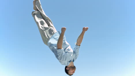 young man jumping in slow motion while making a twist