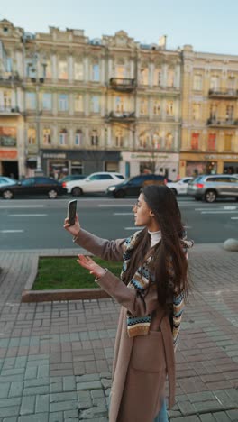 woman taking a selfie in a city street