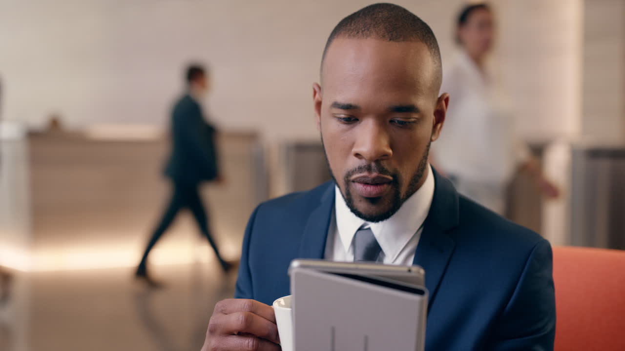 African American Businessman working in business lobby