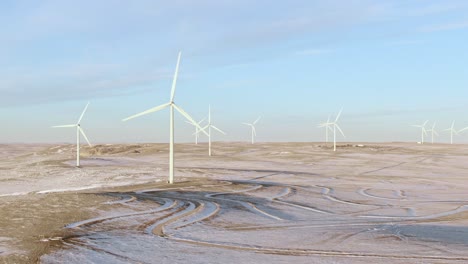 Aerial-shots-of-wind-turbines-on-a-cold-winter-afternoon-in-Calhan,-Colorado