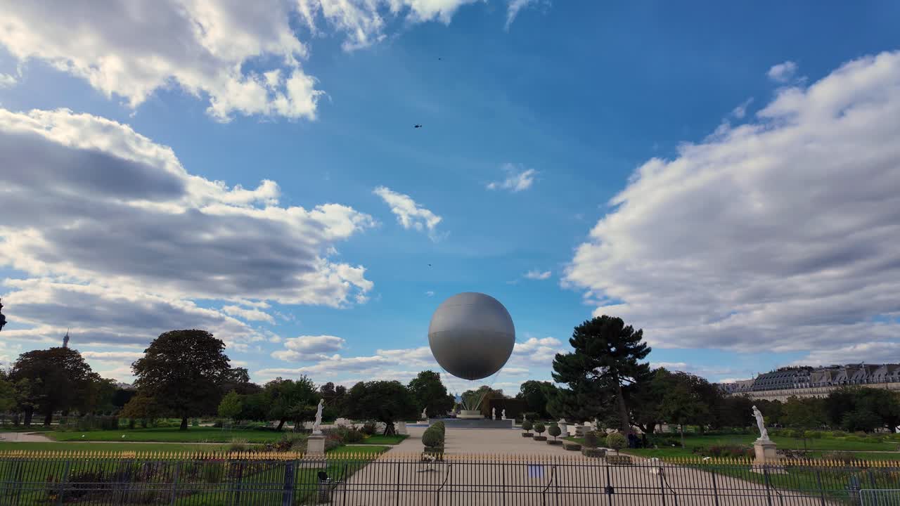Tuileries Garden floating round sculpture ball Paris France landmark day time