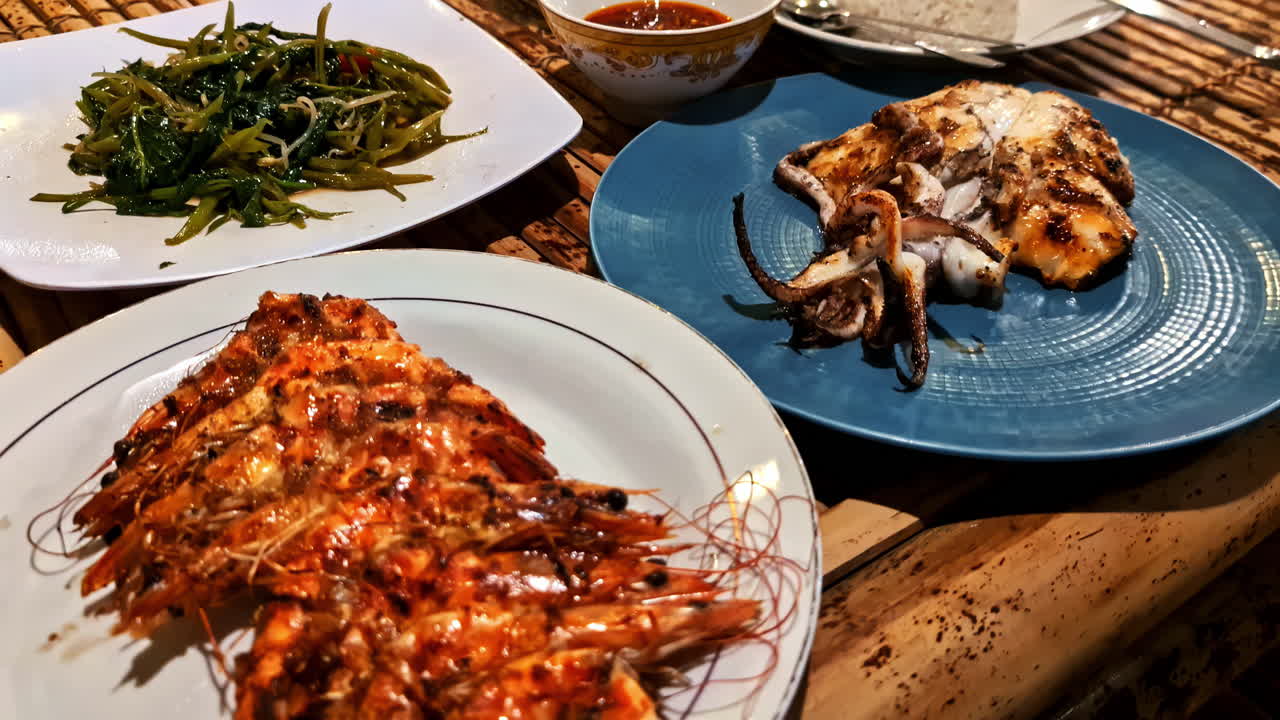 Capturing of plate full grilled prawns and octopus tentacles looking delicious.