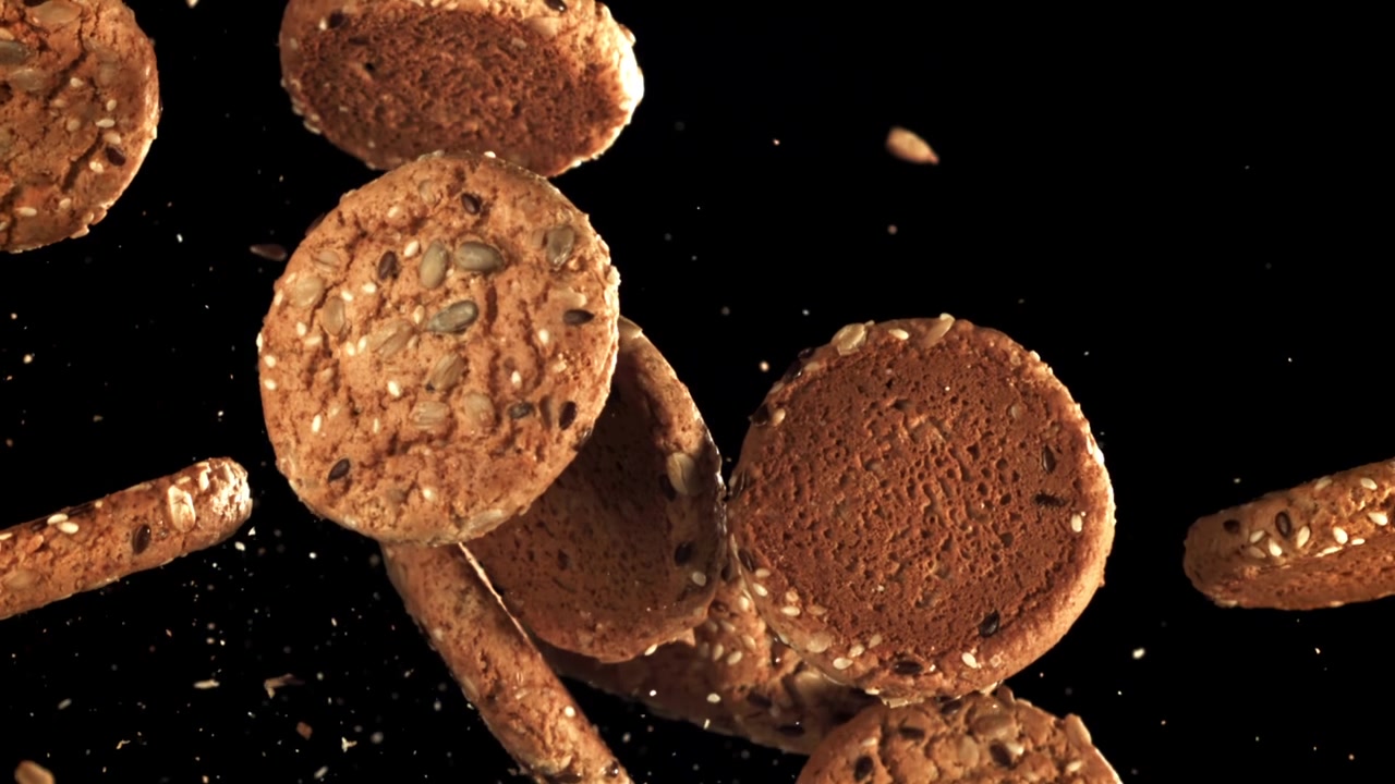 Delicious Whole Grain Cookies with Seeds Falling in Slow Motion