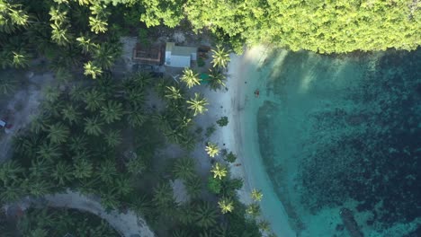 summer landscape of white sand beach with crystal clear blue water of ocean in an island in philippines