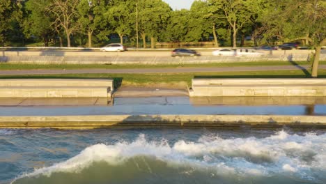 static aerial shot of waves crashing along chicago's lakeshore path due to high water levels