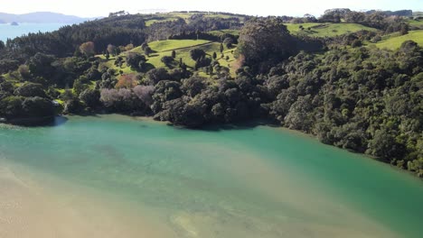 shallow sandbank on the edge of new zealand farmland