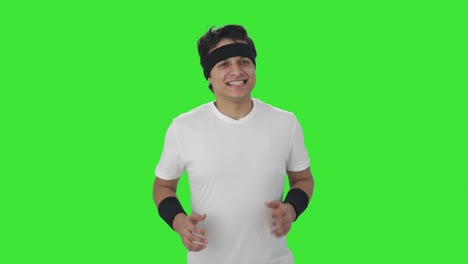 happy indian man doing jogging green screen