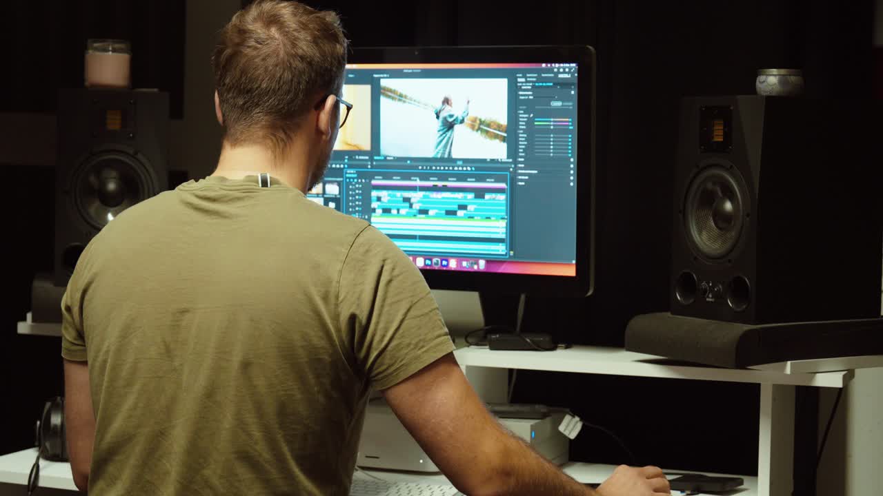 A professional video editor works on a project in Adobe Premiere Pro. Concept of creativity, post-production, color grading, and filmmaking workflow