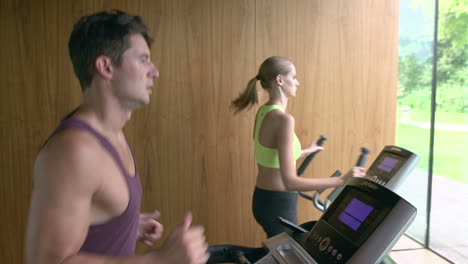 couple exercising together in home gym