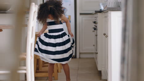 beautiful little girl dancing wearing pretty dress showing off cute dance having fun at home enjoying summer fashion