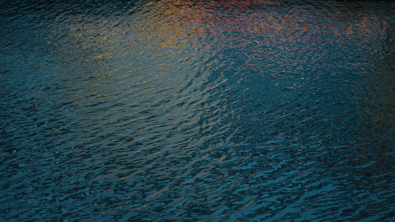 Abstract water ripples in Nyhavn harbor, Copenhagen, reflecting colorful harbor lights with cool tones contrasting warm evening reflections