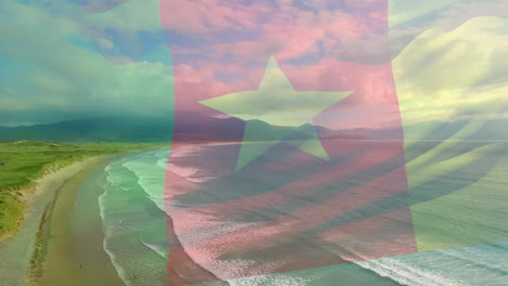 digital composition of cameroon flag waving against aerial view of waves in the sea