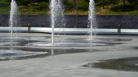 the area with fountains. sunny day