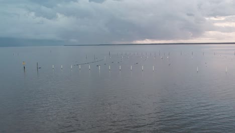 aerial drone shot over oyster beds in st