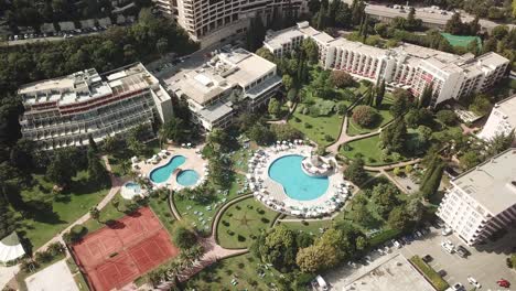 bečići town in the municipality of budva, montenegro aerial top down of swimming pool resort