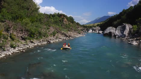 group-paddling-down-the-wild-Vjosa-river-in-Permet,-Albania