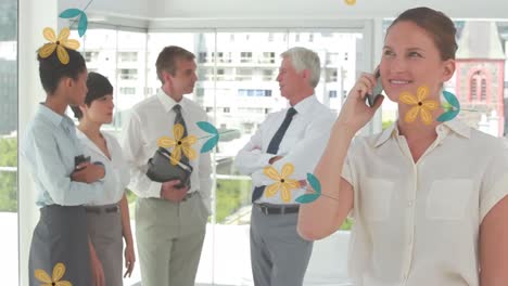 Animation-of-flowers-falling-over-diverse-business-people-in-office