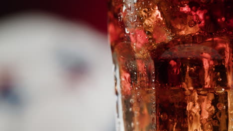 Close up of a glass of cola with ice