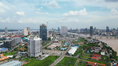 Riverfront urban skyline building construction site and development, Chroy Changva district, Phnom Penh city, Drone view