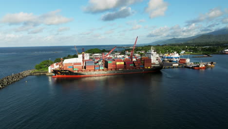 Apia-Harbour-With-Commercial-Shipping-Port-And-Container-Ship-In-Upolu-Island,-Western-Samoa,-South-Pacific---aerial-drone-shot