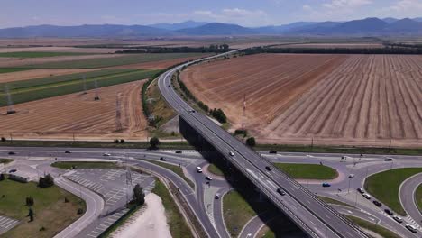 a drone video near brașov, showing traffic on the e574 highway and ring road exit toward hărman in the morning