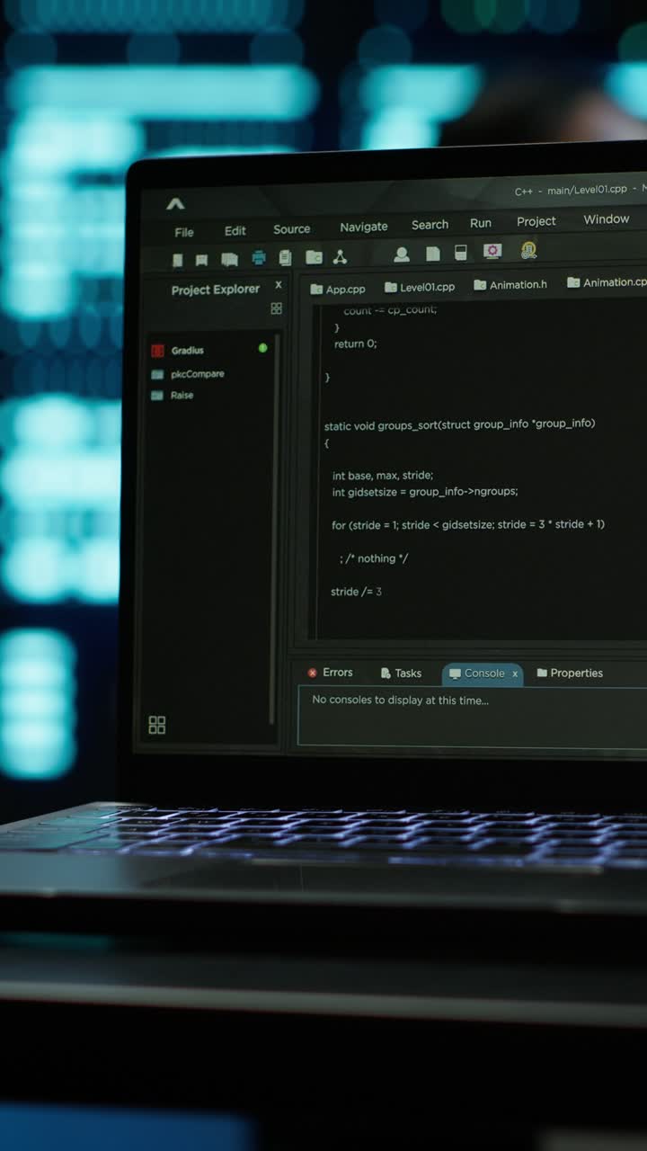Laptop Screen Displaying Programming Code in Dark Environment