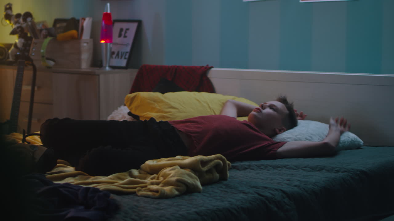 Teenager in his bedroom