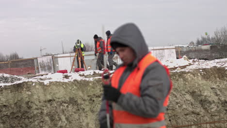 construction surveyors at a winter construction site