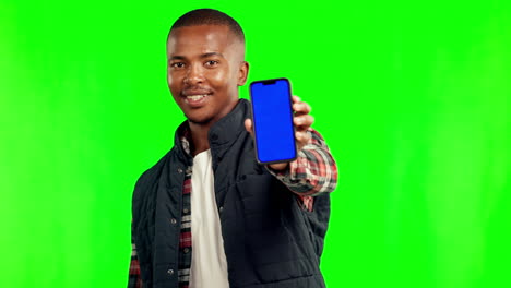 man holding up smartphone with blank blue screen
