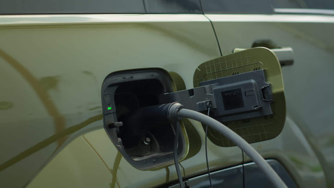 Closeup Of Ev Vehicle Connected To Charging Dock, Emphasizing Sustainability