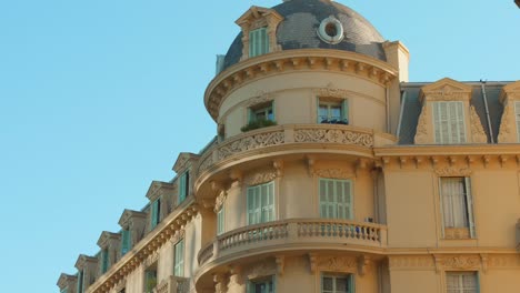 european building exterior in art deco architecture in nice, france. low angle shot