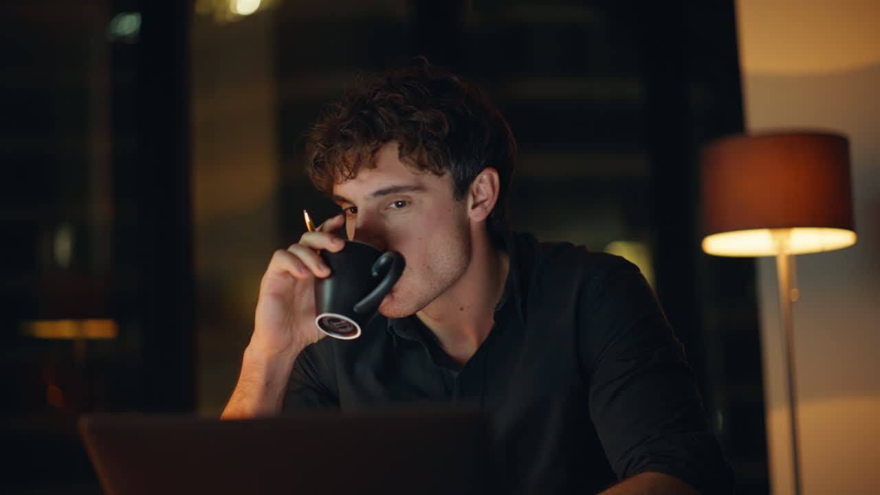 Creative freelancer developing project at laptop sitting night workplace closeup