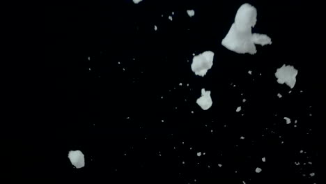 snow flying in the air in slow-motion, black background, 120fps #1