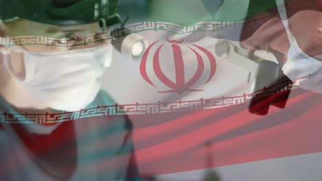 animation of flag of iran waving over surgeons in operating theatre