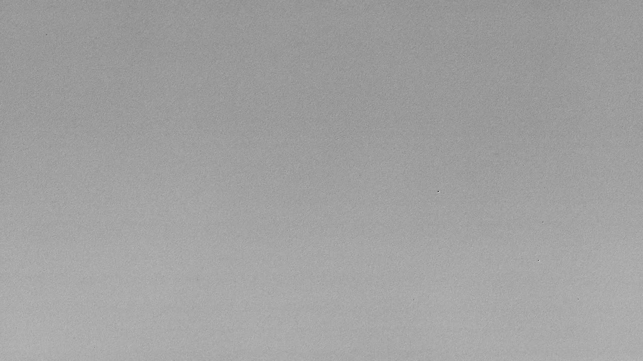 Frame effects white noise corrupted TV on gray background 4K large grain fiber