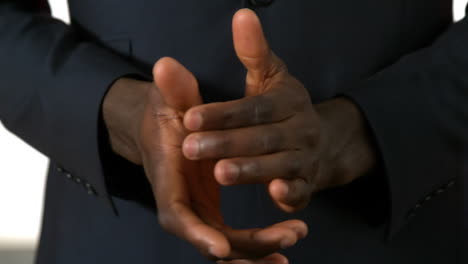 businessman clapping hands on white background