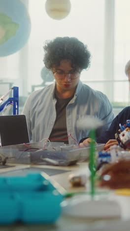 kids building robots in a classroom