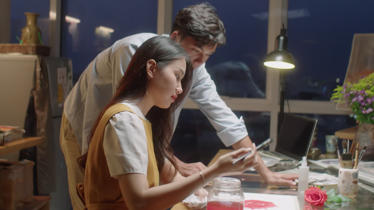 Teacher Giving Art Class to Young Asian Woman