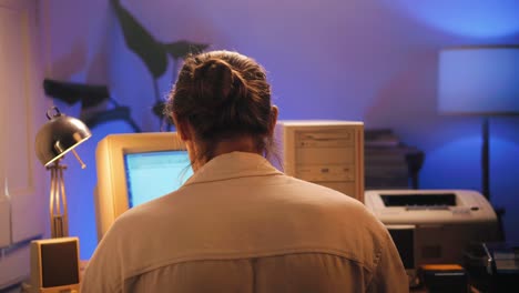man working and gaming on retro computer pc, it engineer with vintage computer at home, using old fashion technology, close up of retro setup.