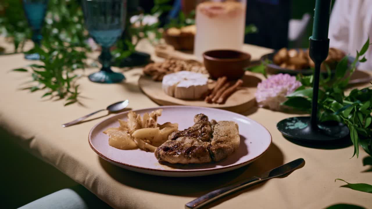 A beautifully arranged dinner table with a variety of dishes and drinks