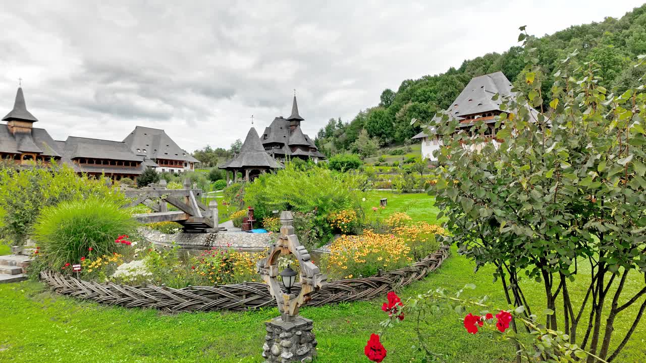 Flower garden at Barsana monastery church complex Maramures Romania
