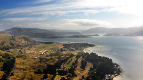 scenic aerial view of a coastal bay and peninsula with hills