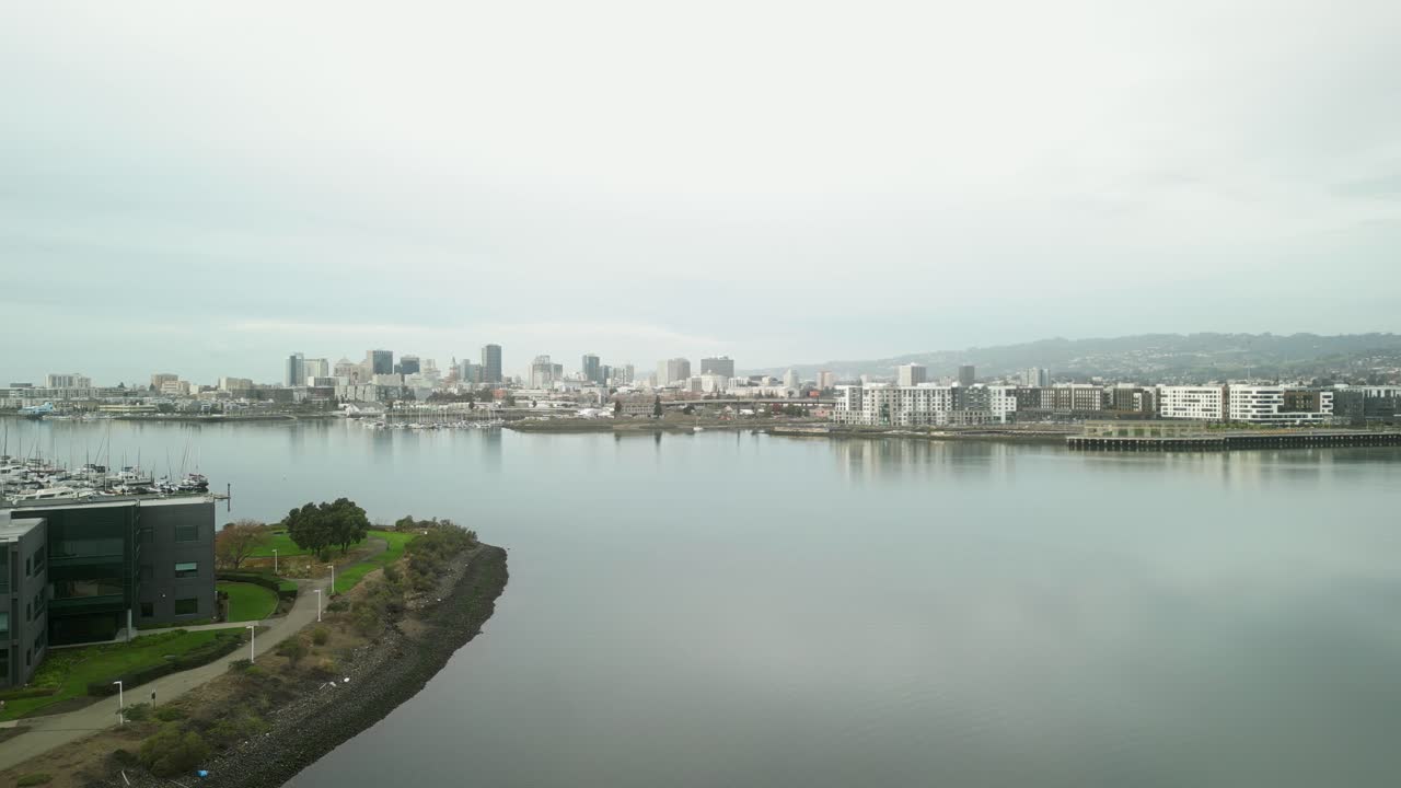 Vibrant aerial drone footage of Jack London Square, emphasizing its role as a hub of culture, dining, and maritime activities in Oakland.