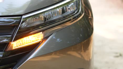 close-up of car headlights and daytime running lights