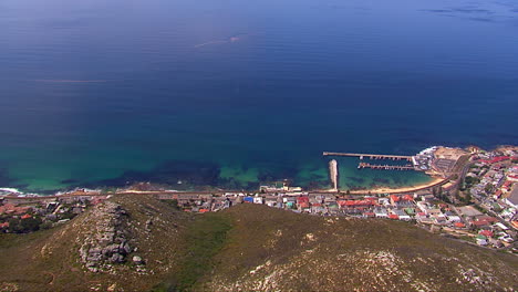kalk bay harbour revealed, with false bay in the background