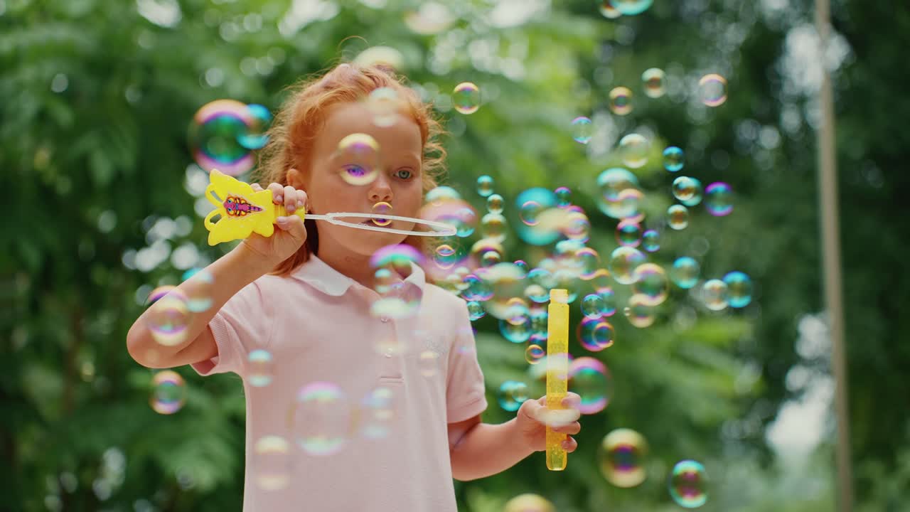 Little Girl Playing with Bubbles