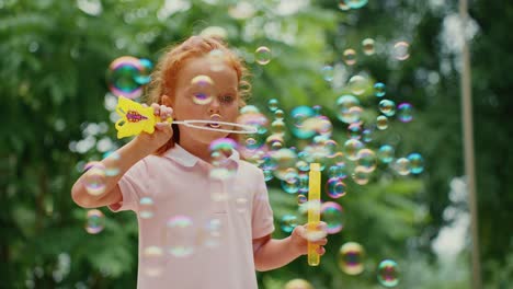 little girl playing with bubbles