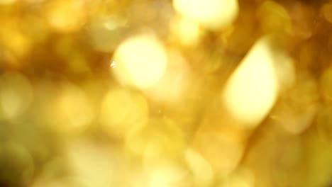 fondo borroso de luz bokeh de color dorado, popular en el festival general. hacer la imagen de lujo en su pieza de trabajo.